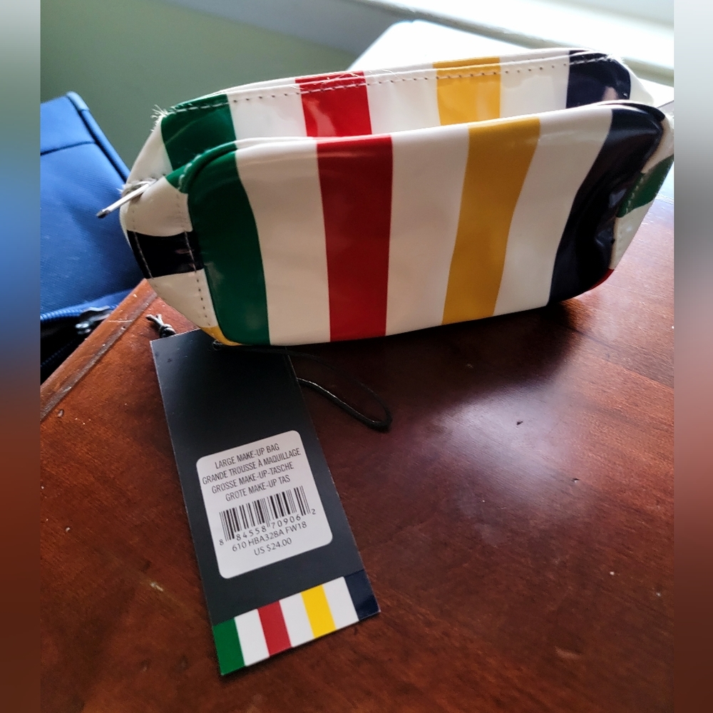 striped makeup bag with bonus mini Laura Mercier lipstick